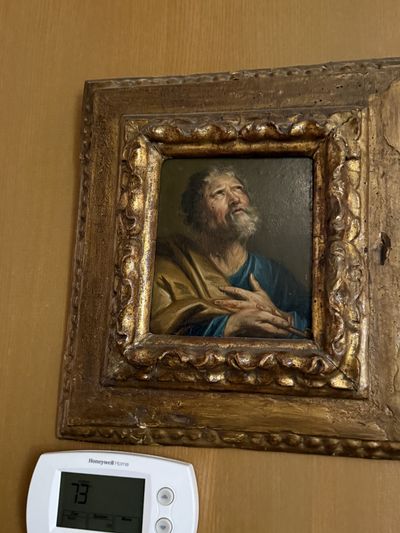An Old Master oil painting of a bearded saint in a carved and gilded frame