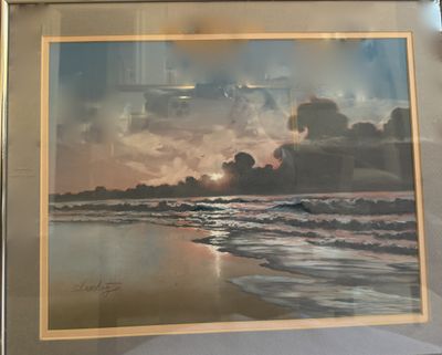 A framed pastel of surf breaking on a beach at sunset